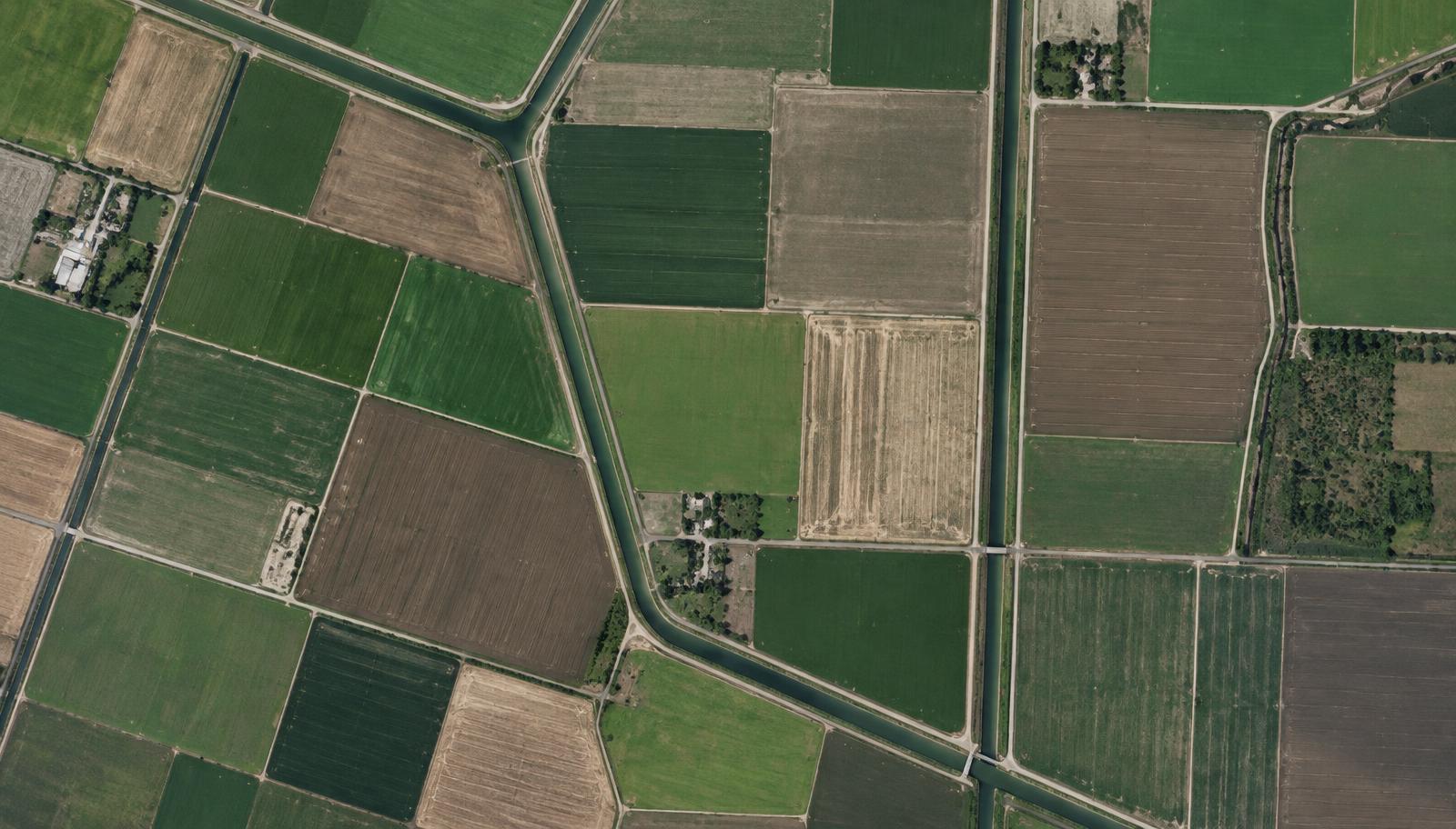 Illustrative overhead view of agricultural field parcels and canals