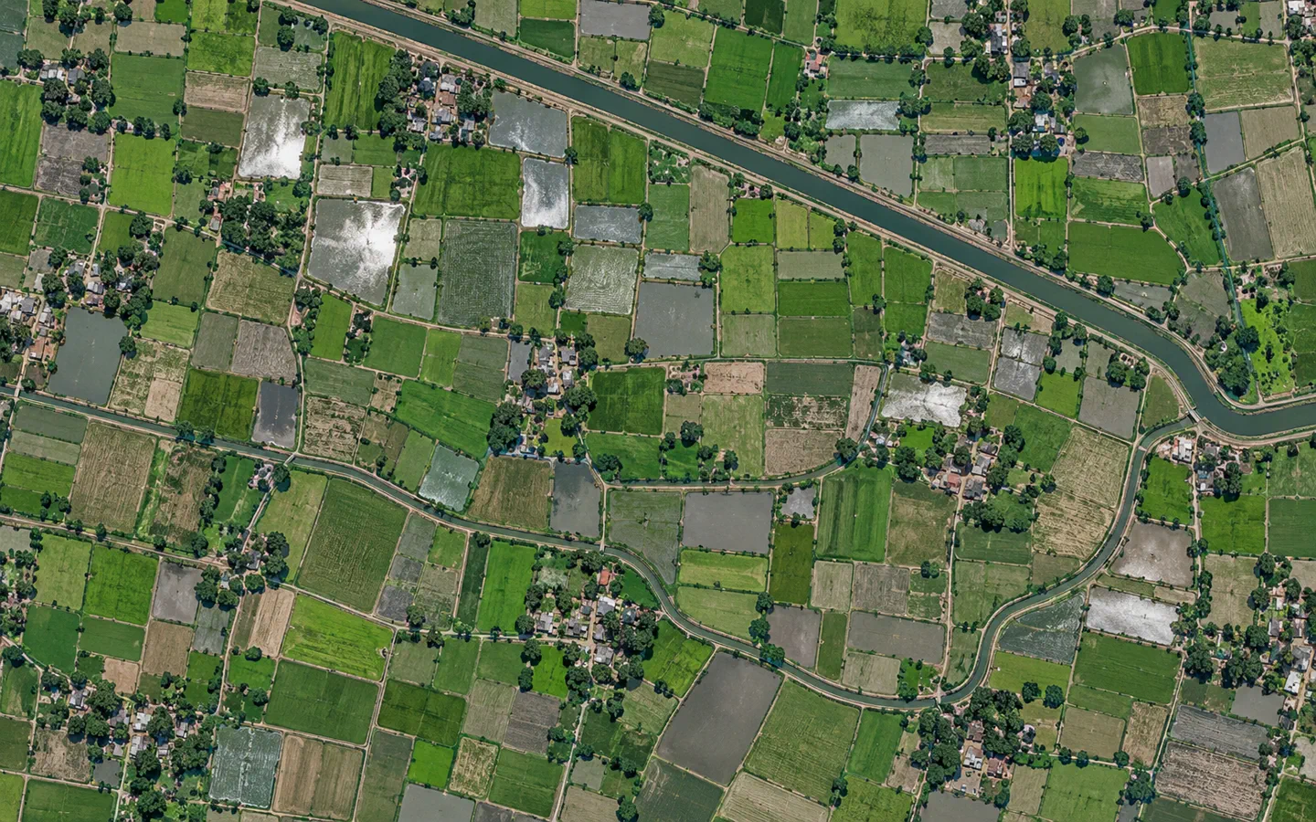 Illustrative overhead view of crop parcels and irrigation channels